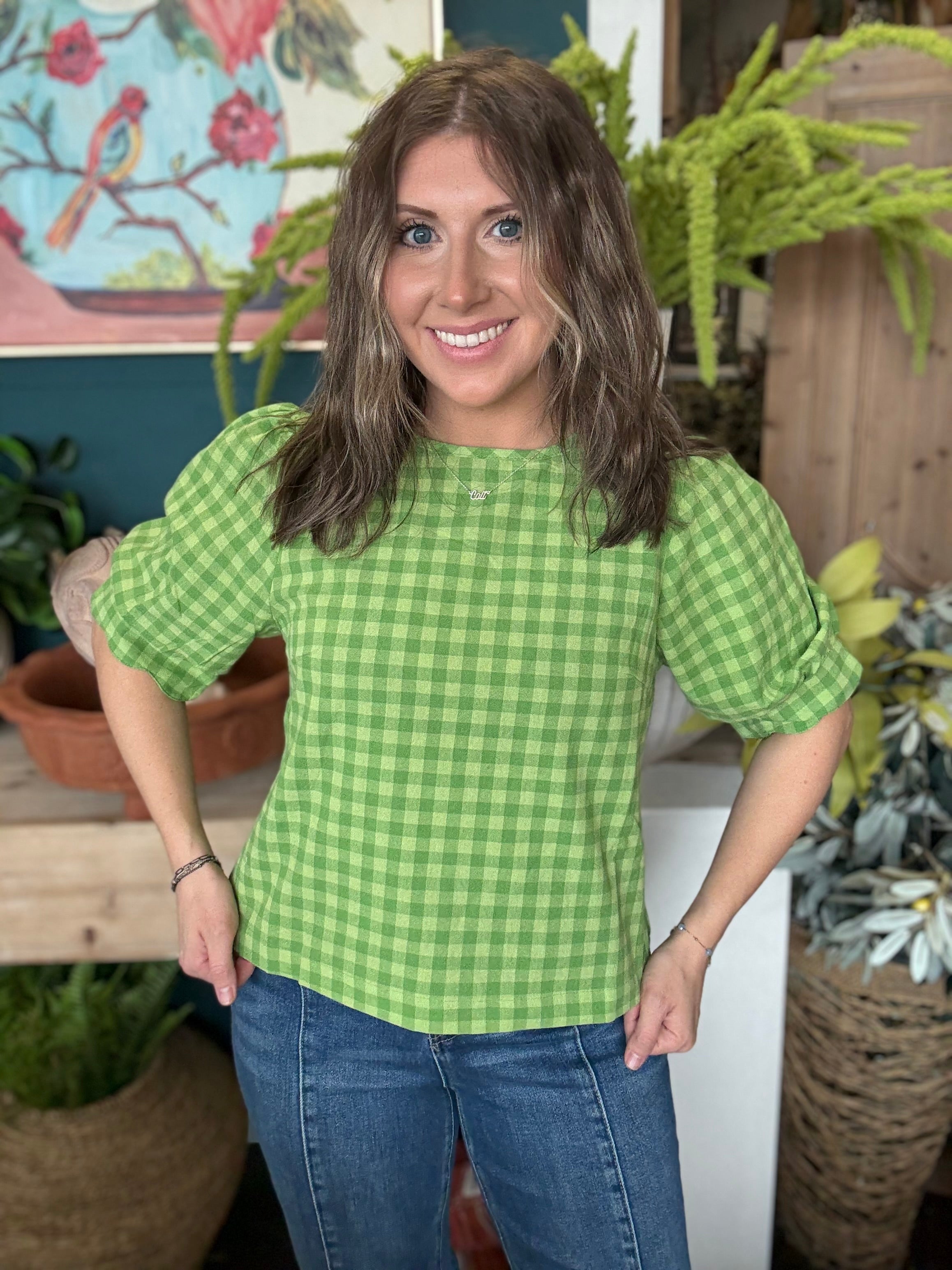 woman wearing lime green gingham puff sleeve boutique top