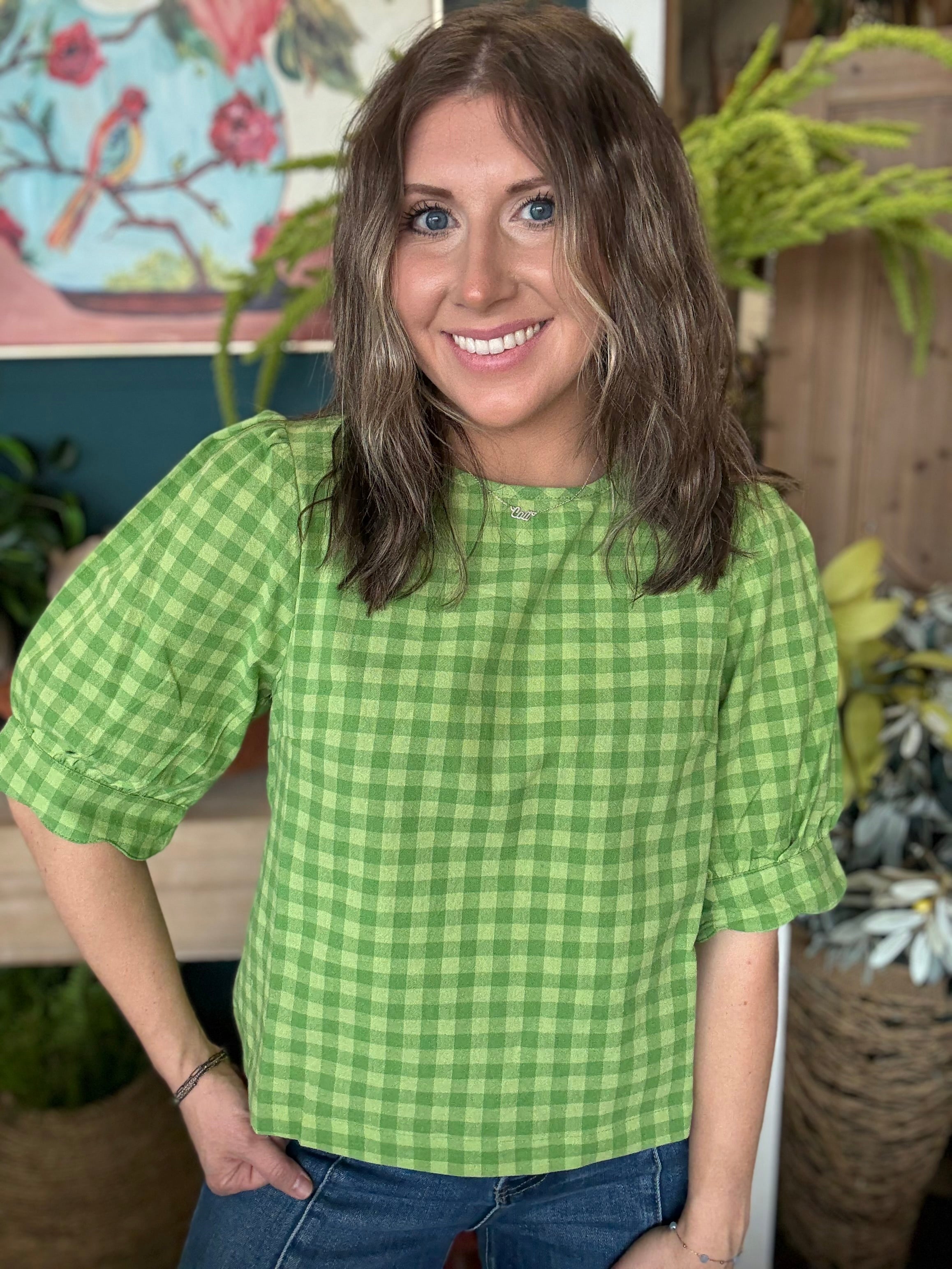 woman wearing lime green gingham puff sleeve boutique top