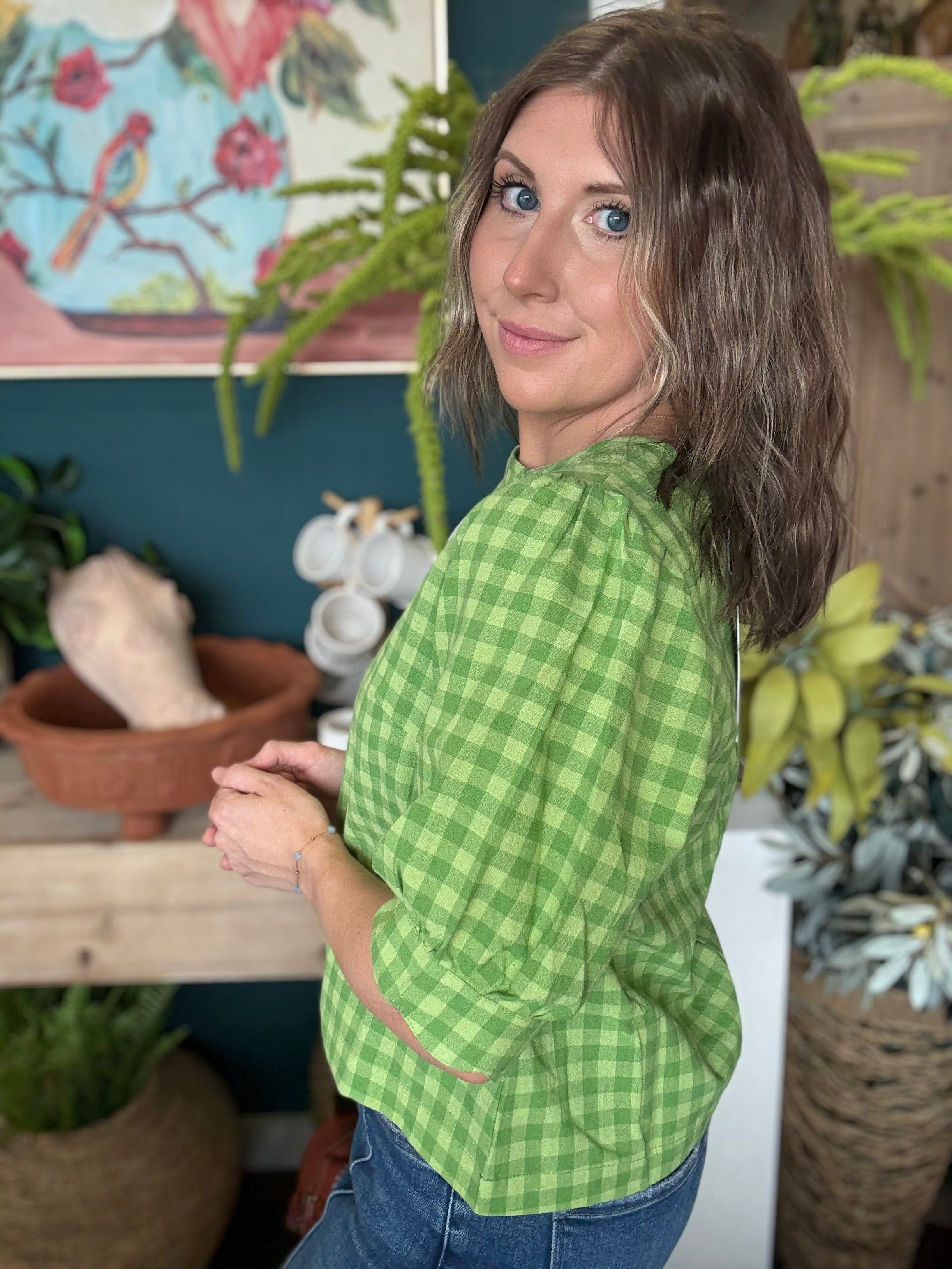 woman wearing lime green gingham puff sleeve boutique top