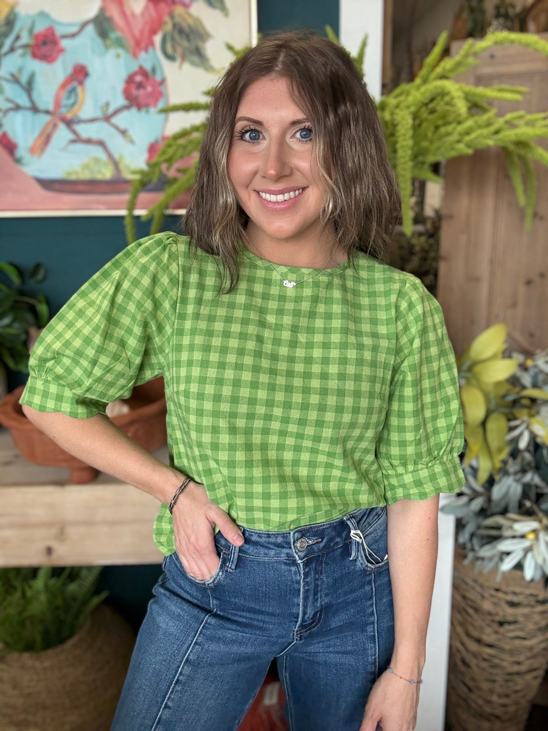 woman wearing lime green gingham puff sleeve boutique top