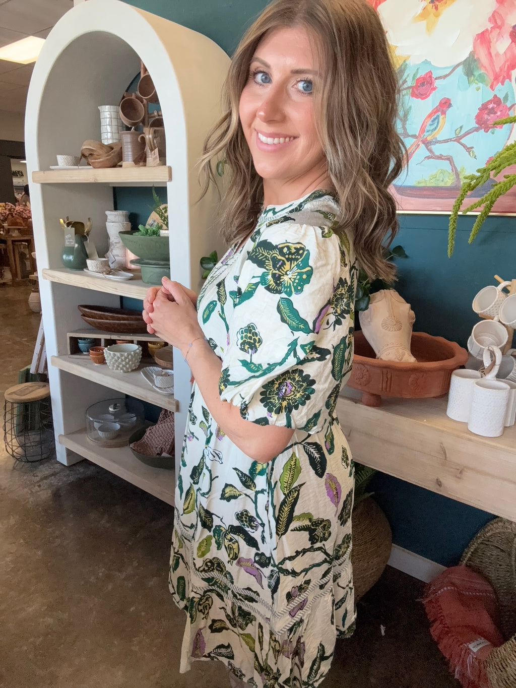 woman wearing woven botanical print mini dress with pockets