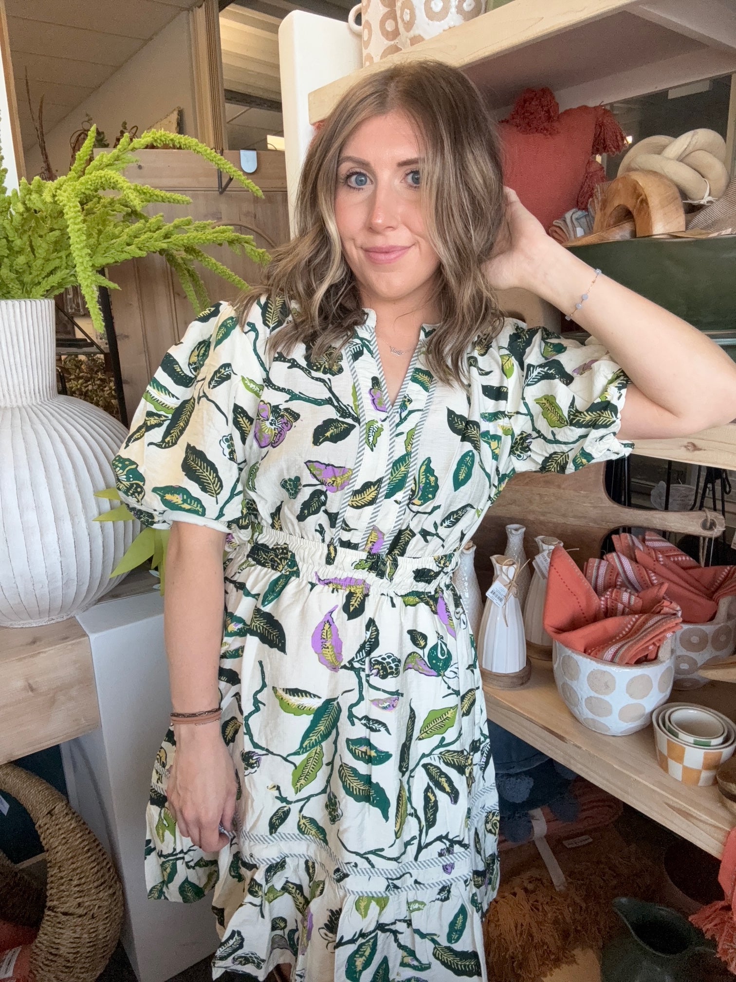 woman wearing woven botanical print mini dress with pockets