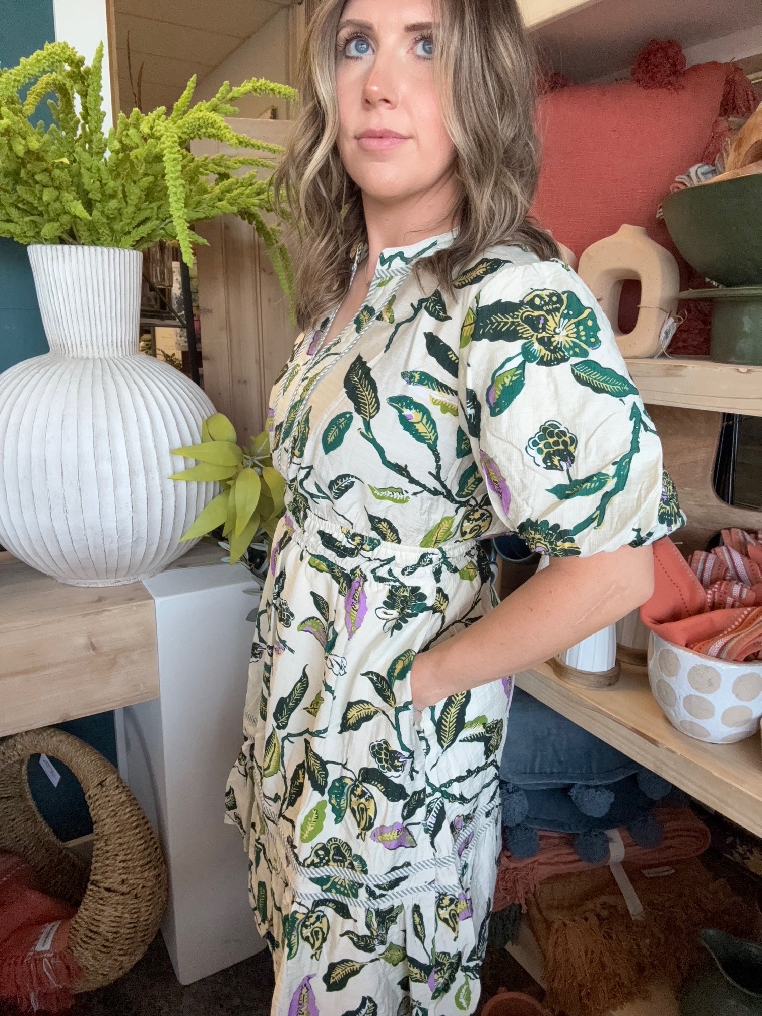 woman wearing woven botanical print mini dress with pockets