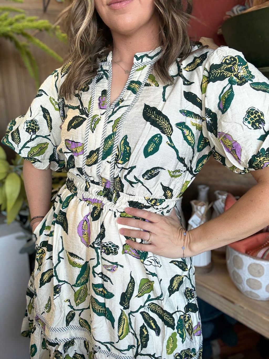 woman wearing woven botanical print mini dress with pockets