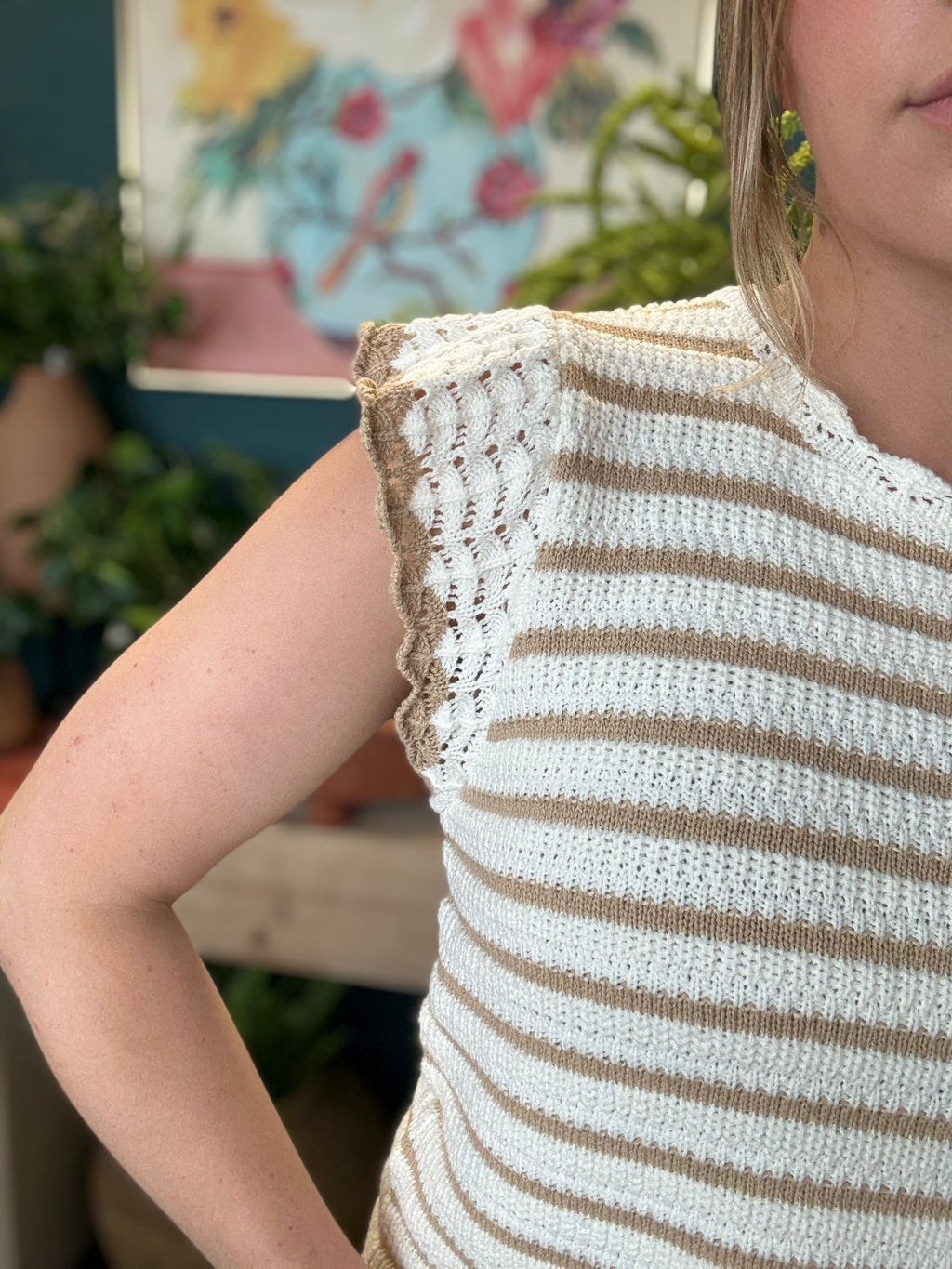 woman wearing taupe and ivory striped sweater top with crochet ruffle sleeves