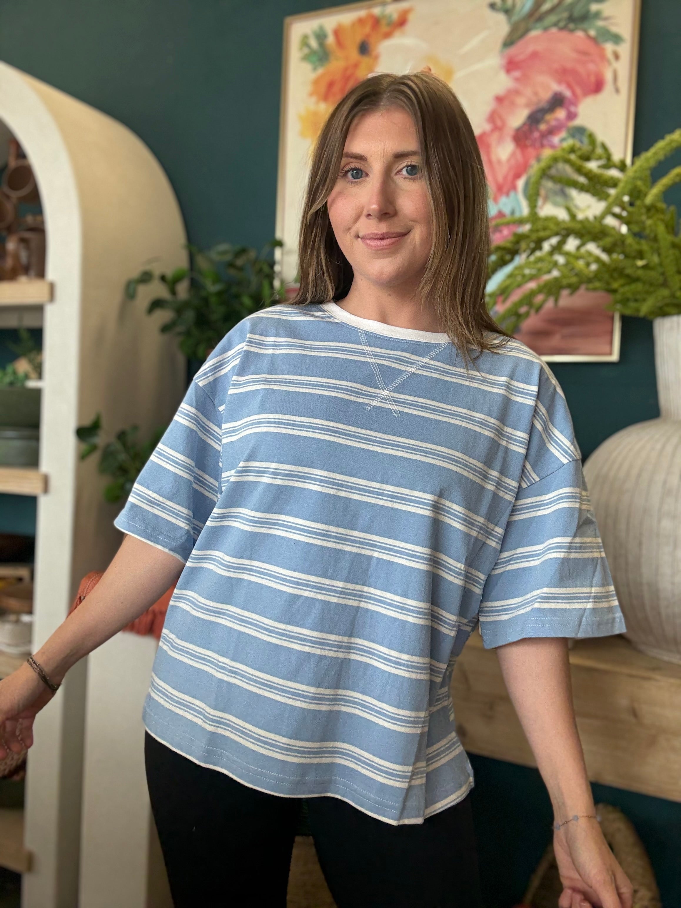 woman wearing blue and white striped oversized boutique tee