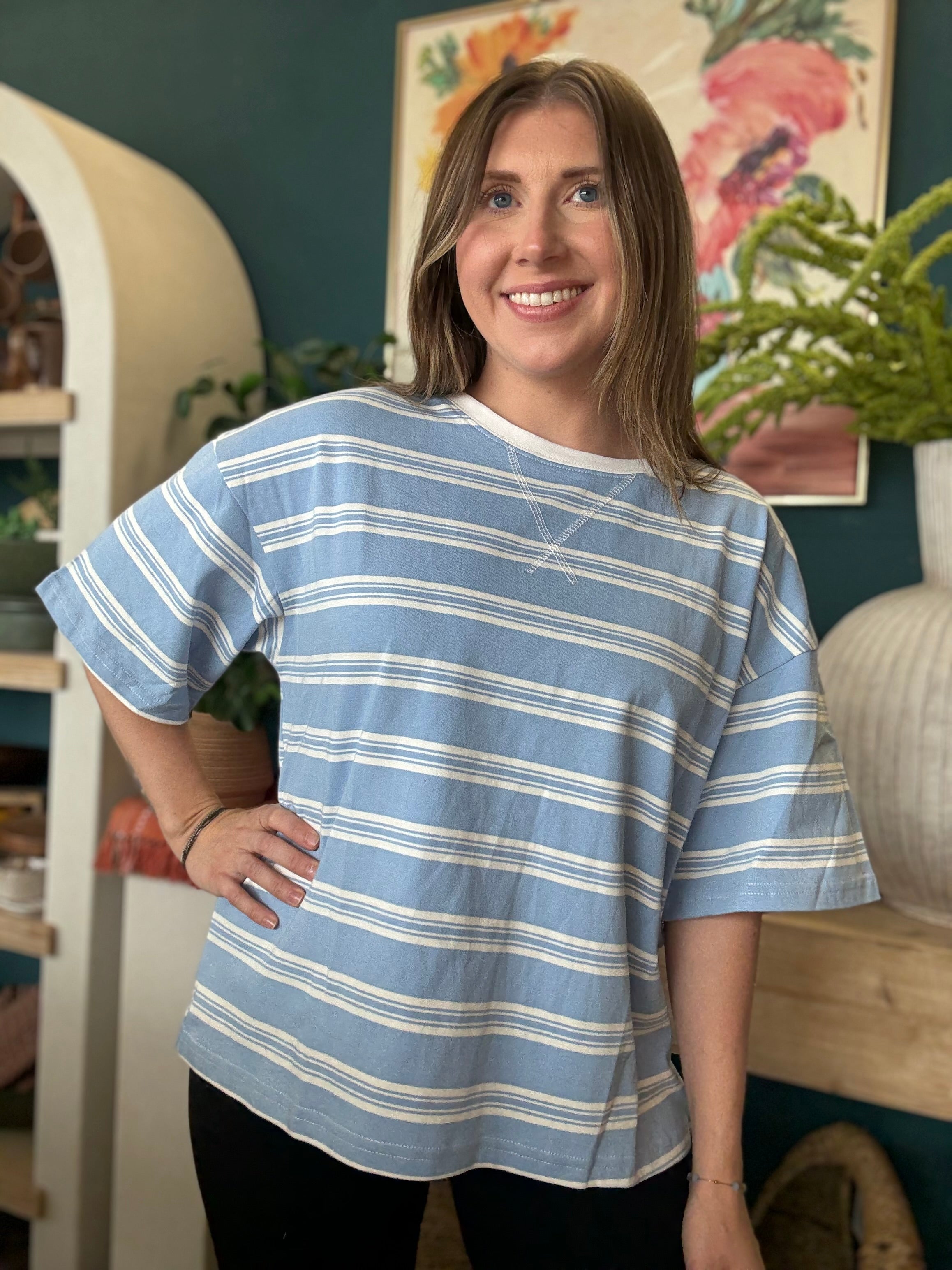 woman wearing blue and white striped oversized boutique tee
