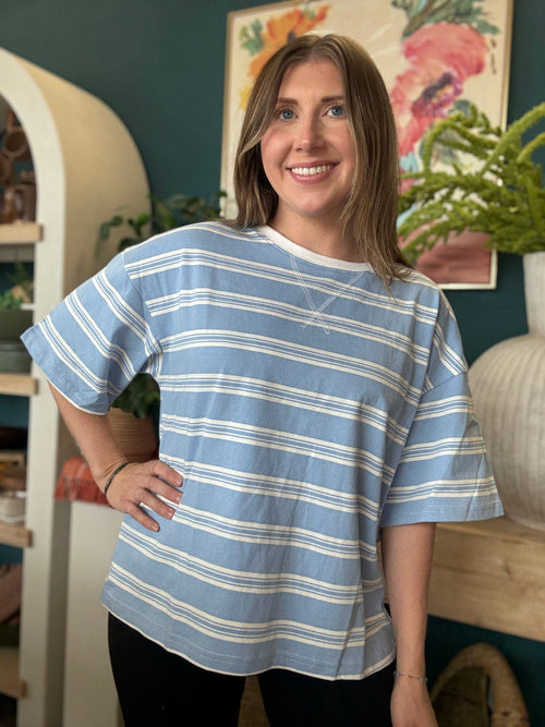woman wearing blue and white striped oversized boutique tee