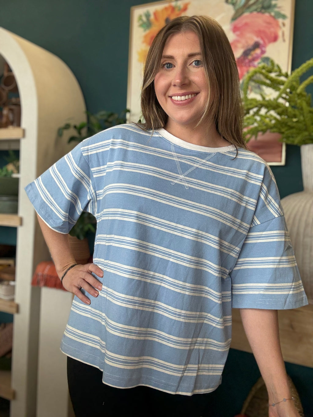 woman wearing blue and white striped oversized boutique tee