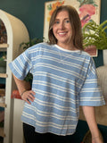 woman wearing blue and white striped oversized boutique tee