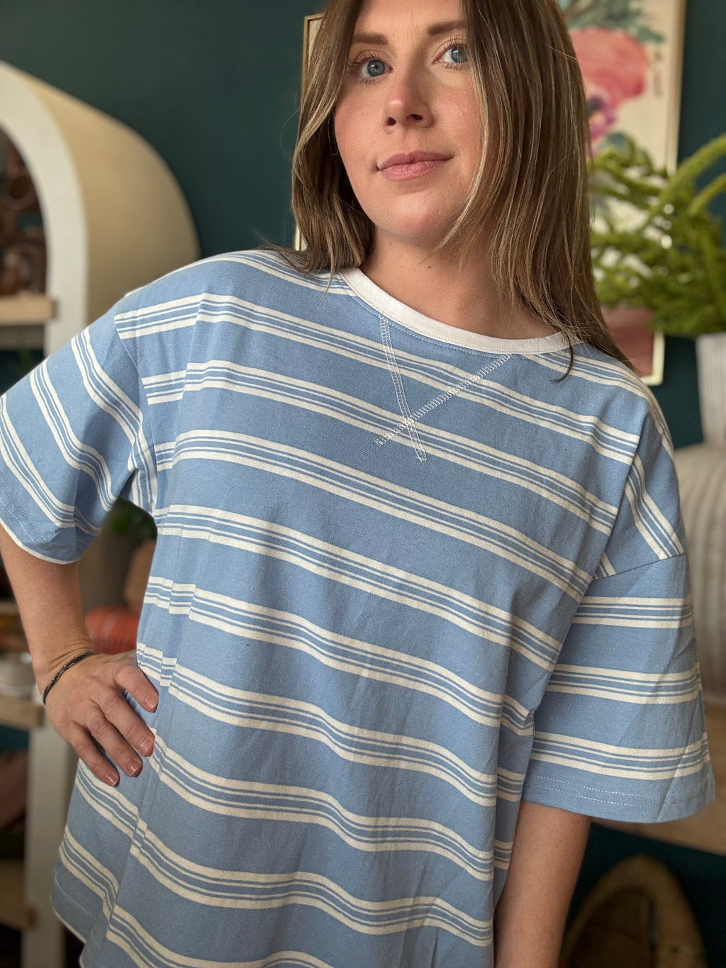 woman wearing blue and white striped oversized boutique tee
