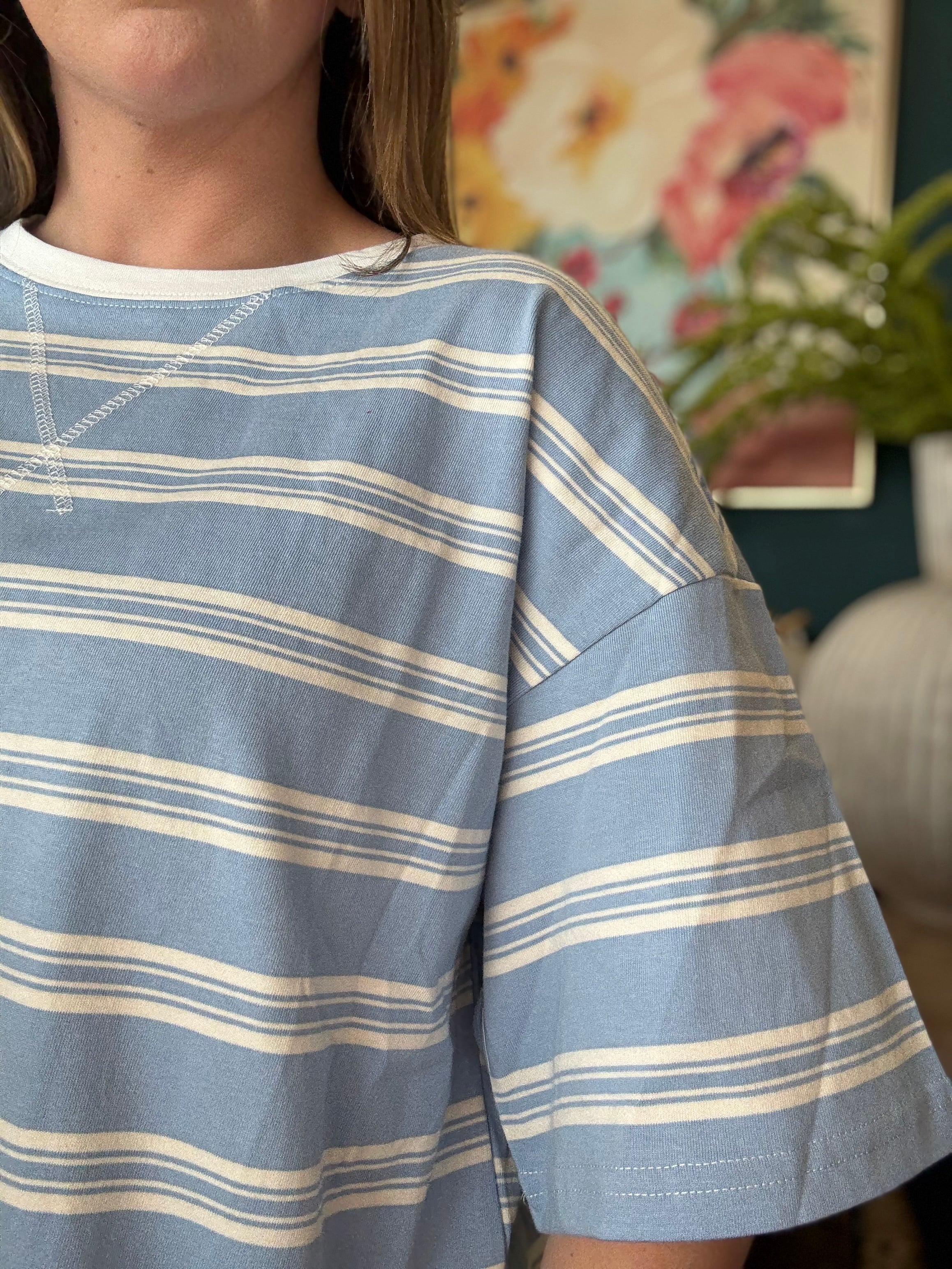 woman wearing blue and white striped oversized boutique tee