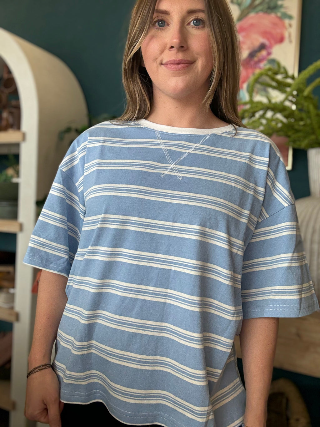 woman wearing blue and white striped oversized boutique tee