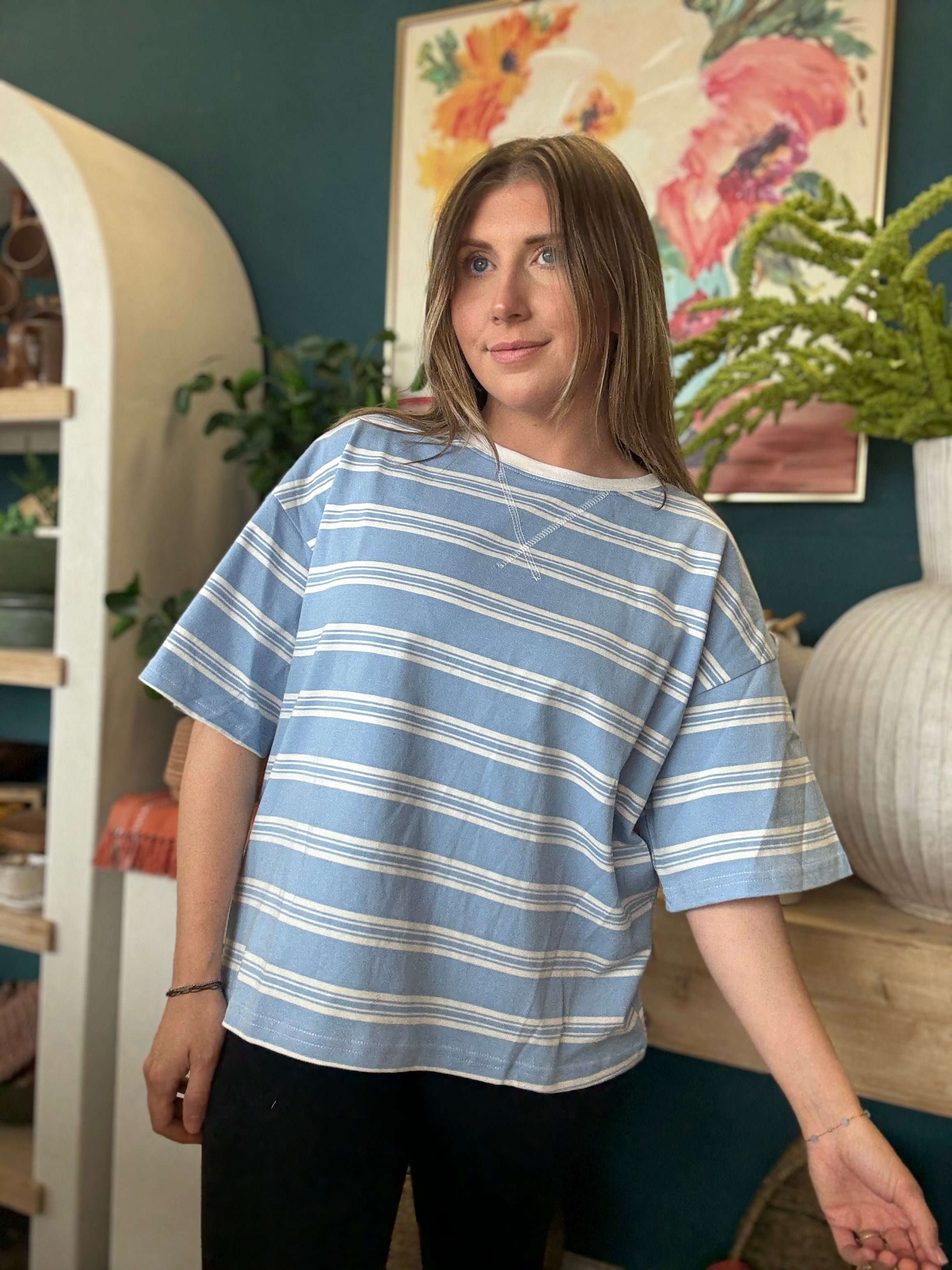 woman wearing blue and white striped oversized boutique tee