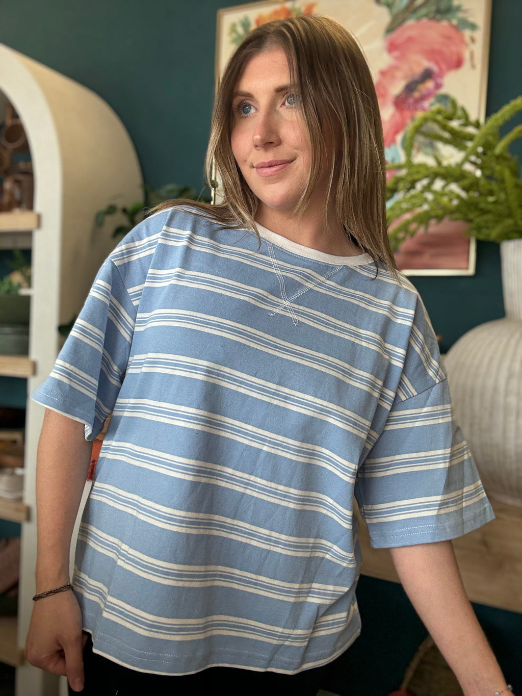 woman wearing blue and white striped oversized boutique tee