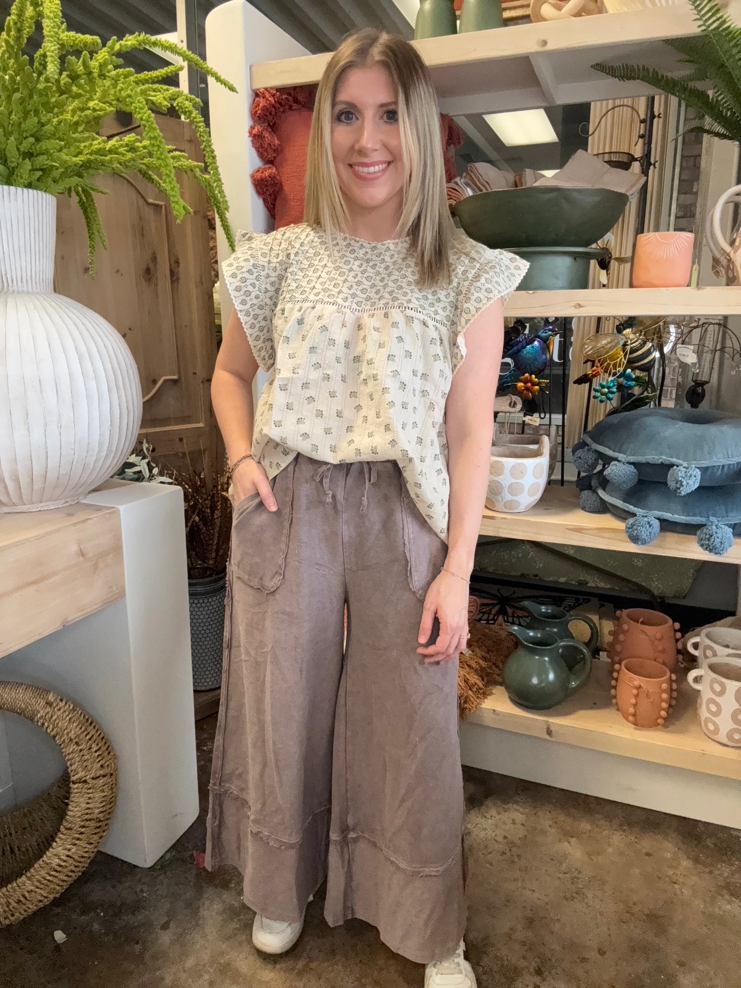 woman wearing mocha drawstring wide leg boutique pants with front pockets