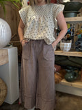 woman wearing mocha drawstring wide leg boutique pants with front pockets