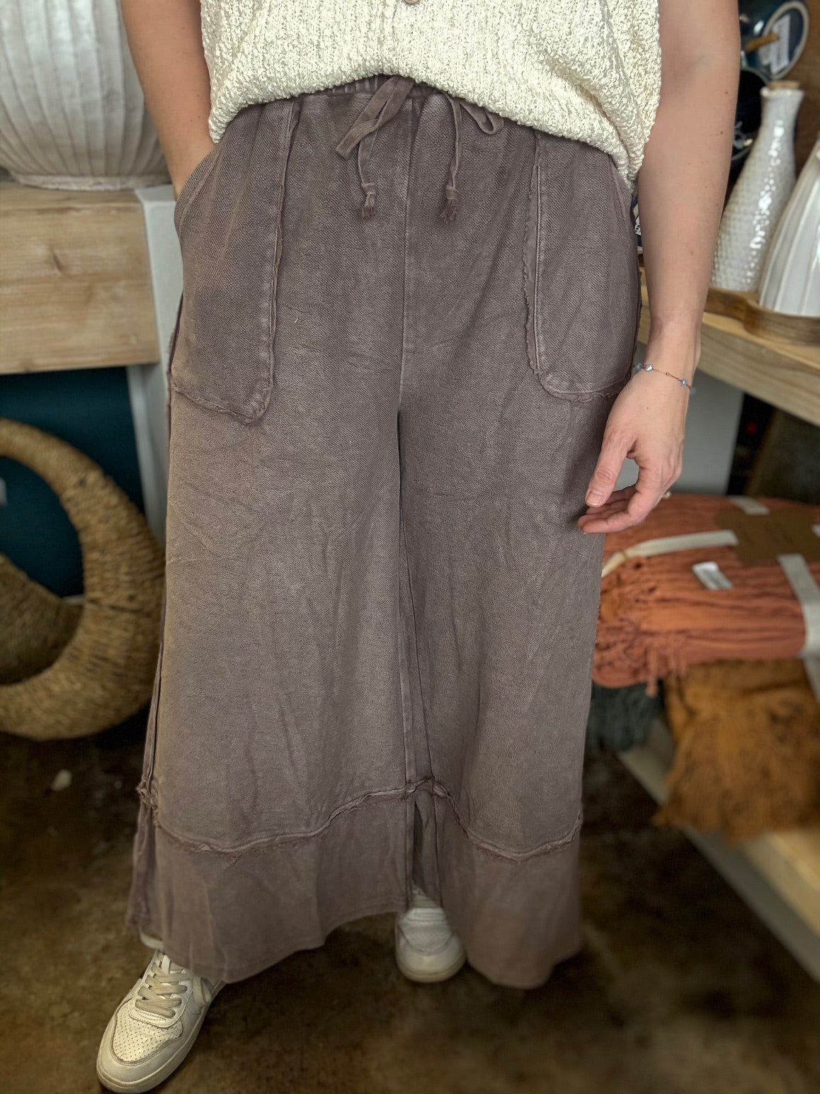 woman wearing mocha drawstring wide leg boutique pants with front pockets