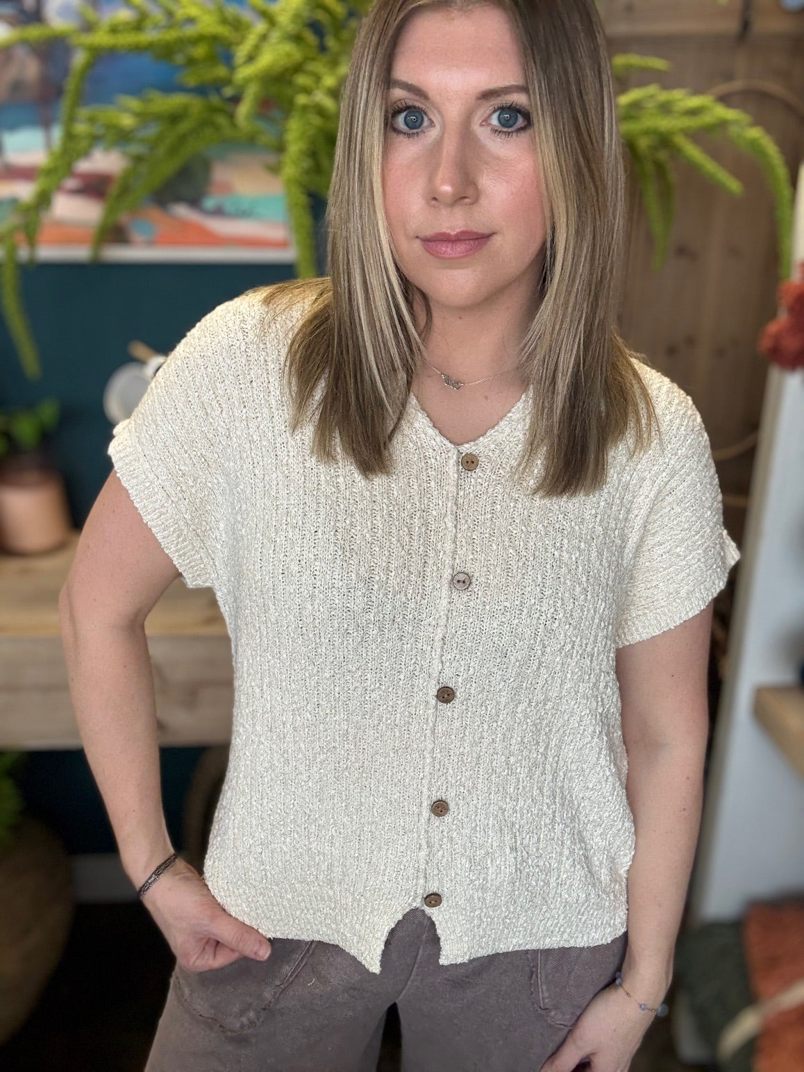 Cream textured button front boutique top styled with relaxed wide leg pants at Pill Box Boutique