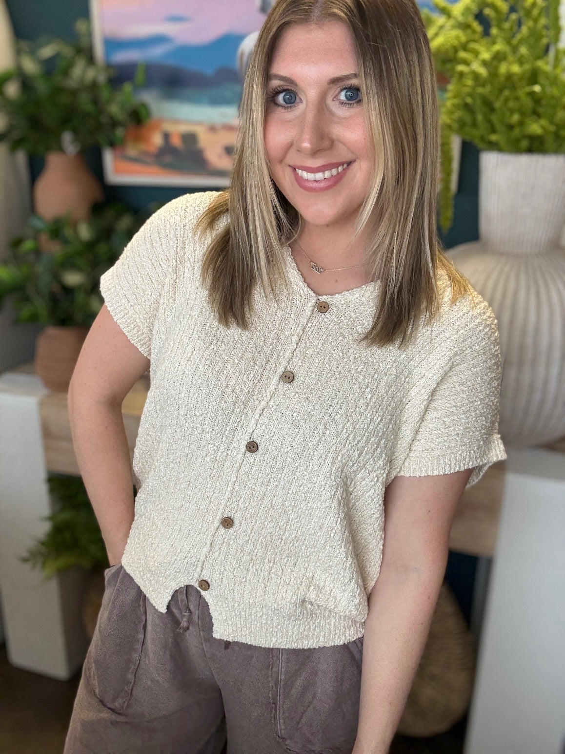 Cream textured button front boutique top styled with relaxed wide leg pants at Pill Box Boutique