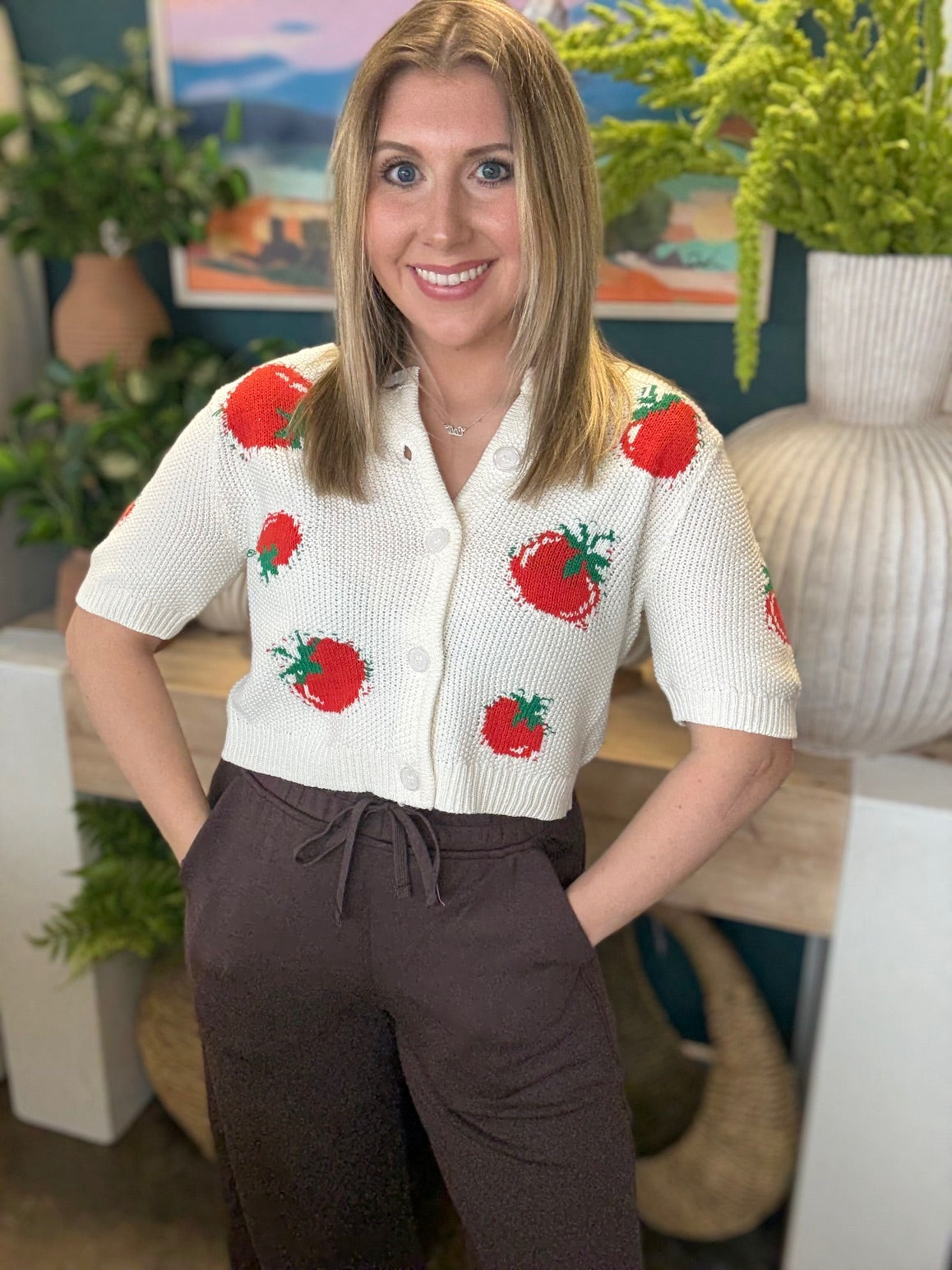 White knit strawberry button front boutique top styled with casual pants at Pill Box Boutique