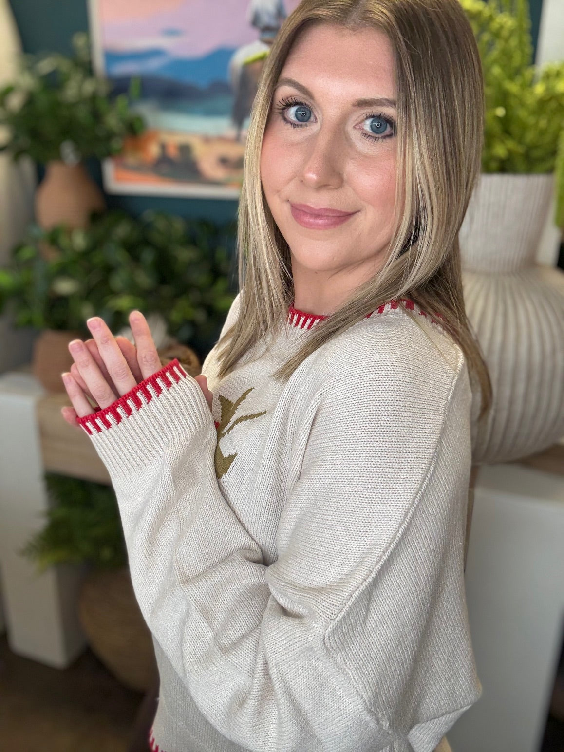 Strawberry graphic knit boutique sweater with contrast stitching styled with casual pants at Pill Box Boutique