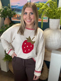 Strawberry graphic knit boutique sweater with contrast stitching styled with casual pants at Pill Box Boutique