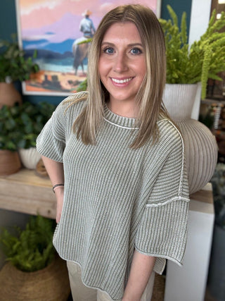 Sage ribbed knit short sleeve boutique top styled with neutral pants at Pill Box Boutique