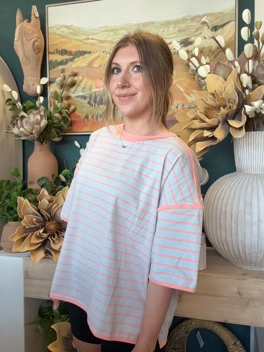 women's blue and apricot striped oversized knit top with relaxed fit and exposed seam details