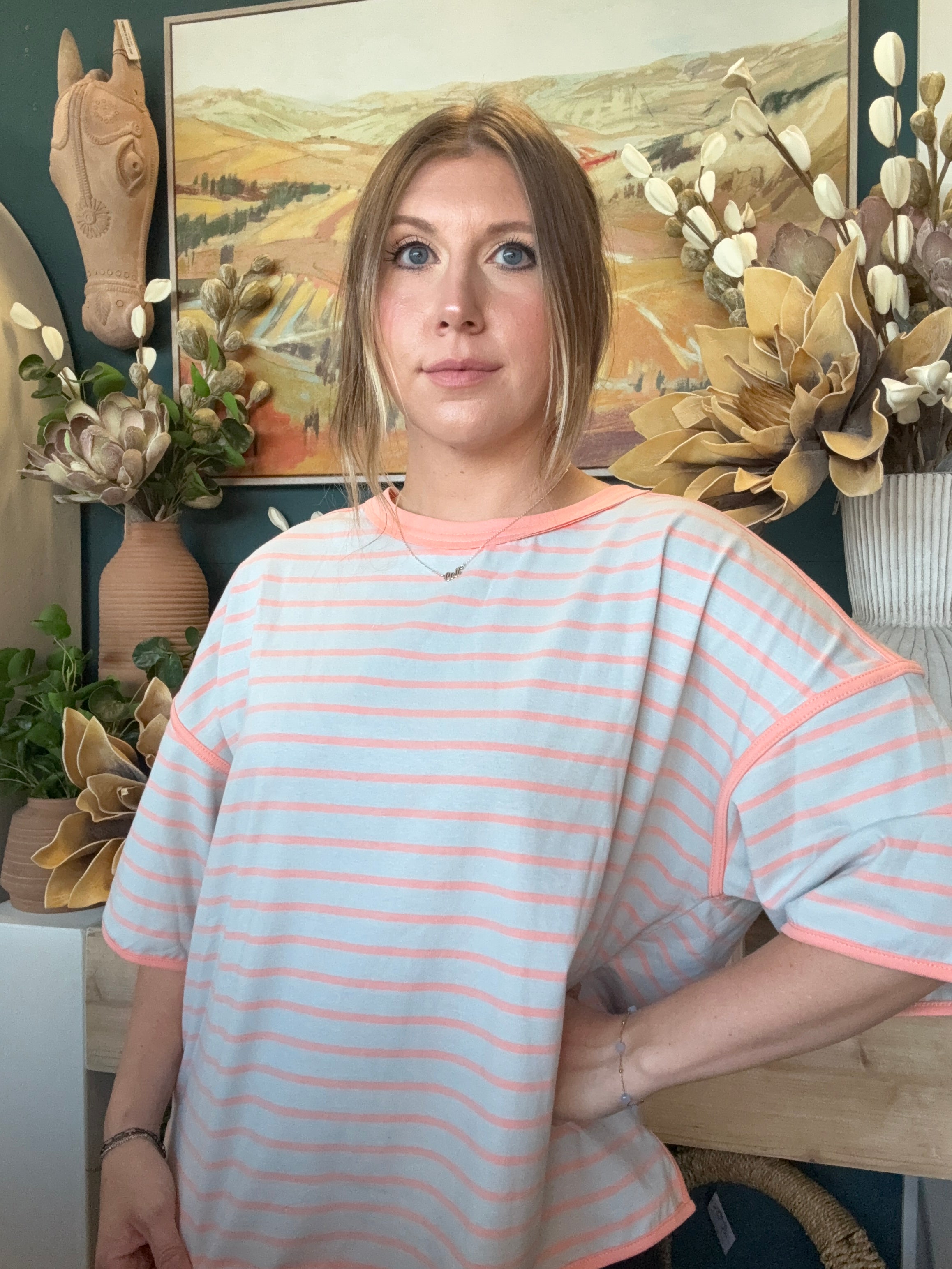 women's blue and apricot striped oversized knit top with relaxed fit and exposed seam details