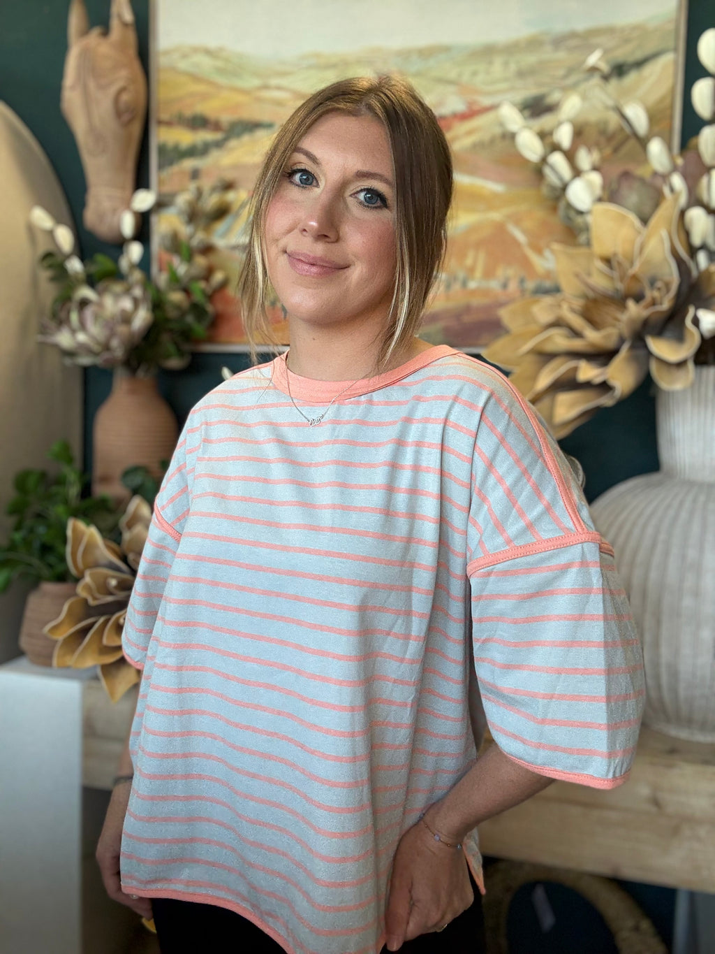 women's blue and apricot striped oversized knit top with relaxed fit and exposed seam details