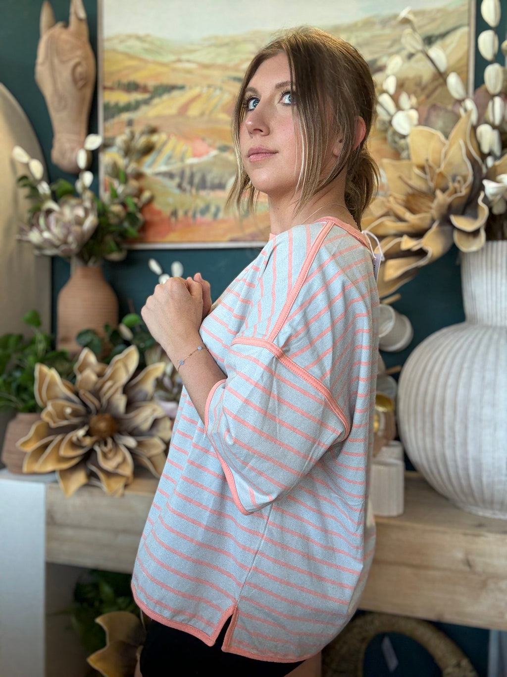 women's blue and apricot striped oversized knit top with relaxed fit and exposed seam details