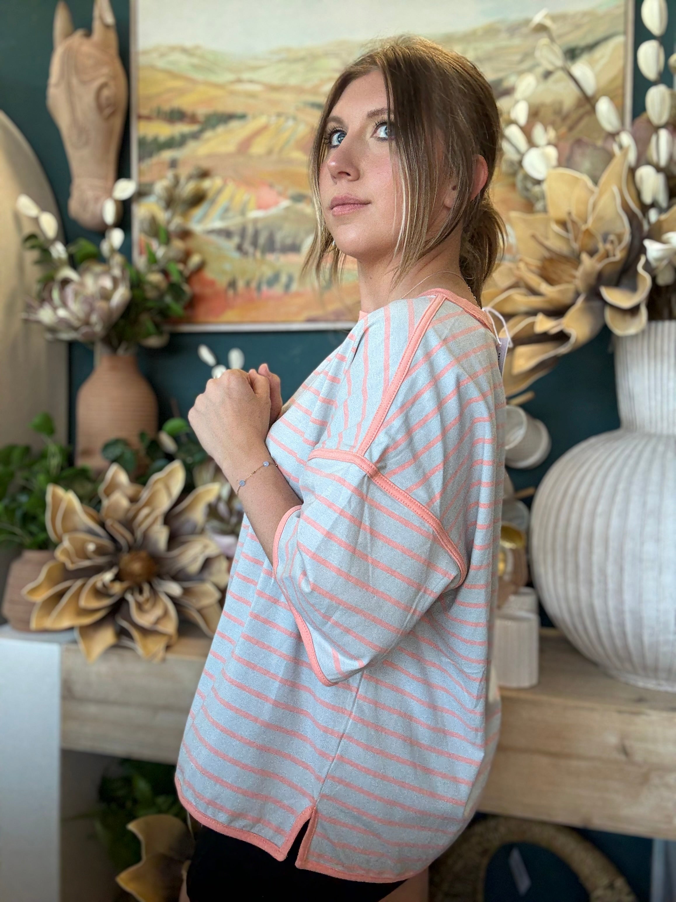women's blue and apricot striped oversized knit top with relaxed fit and exposed seam details