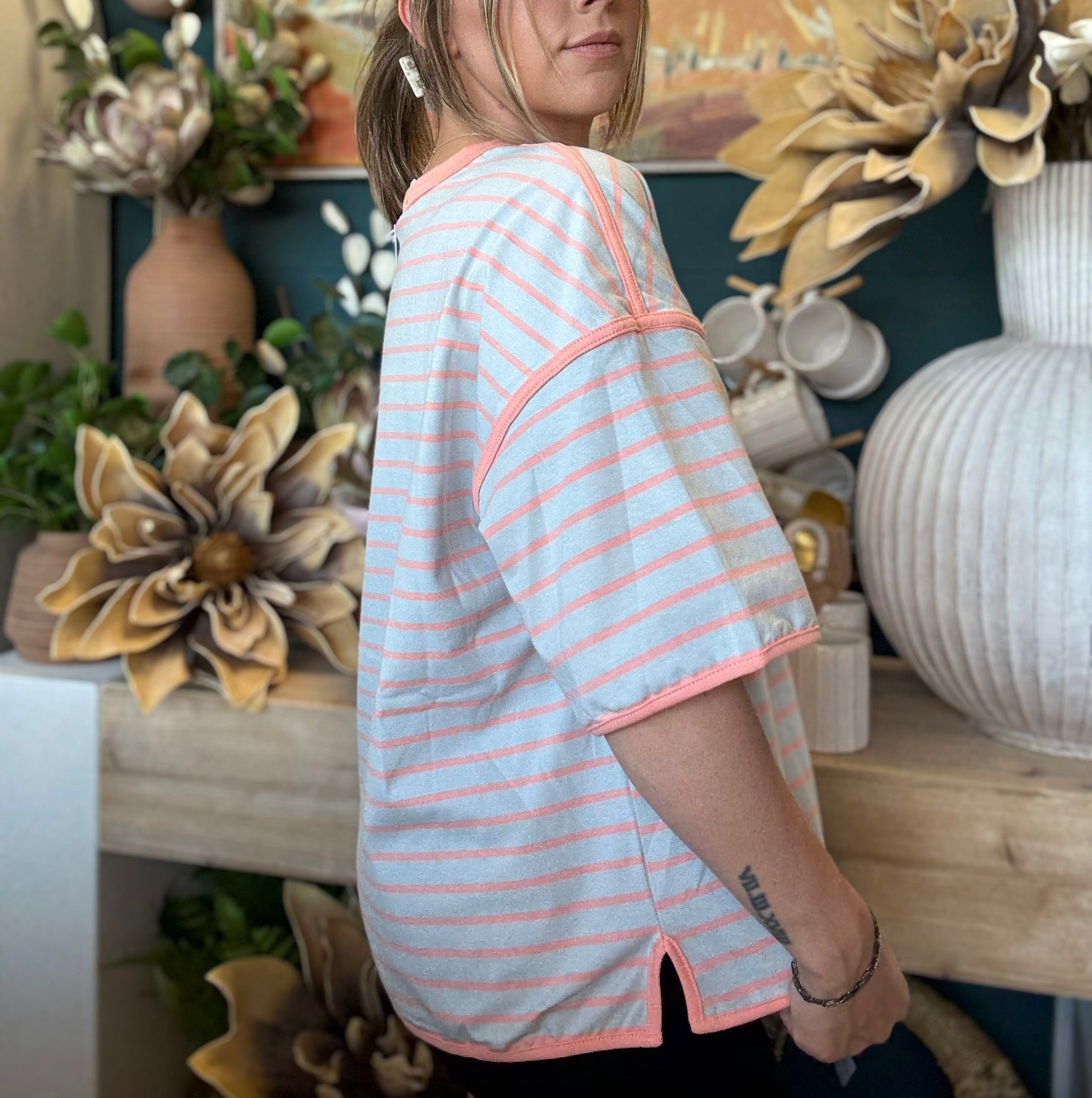 women's blue and apricot striped oversized knit top with relaxed fit and exposed seam details