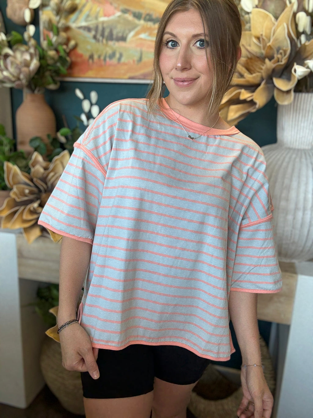 women's blue and apricot striped oversized knit top with relaxed fit and exposed seam details