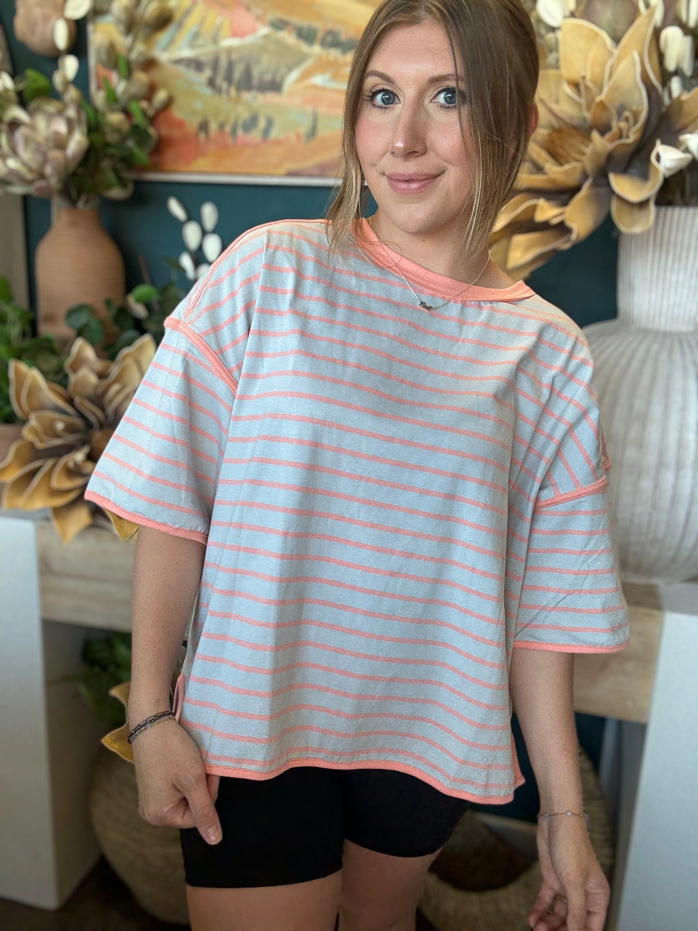 women's blue and apricot striped oversized knit top with relaxed fit and exposed seam details