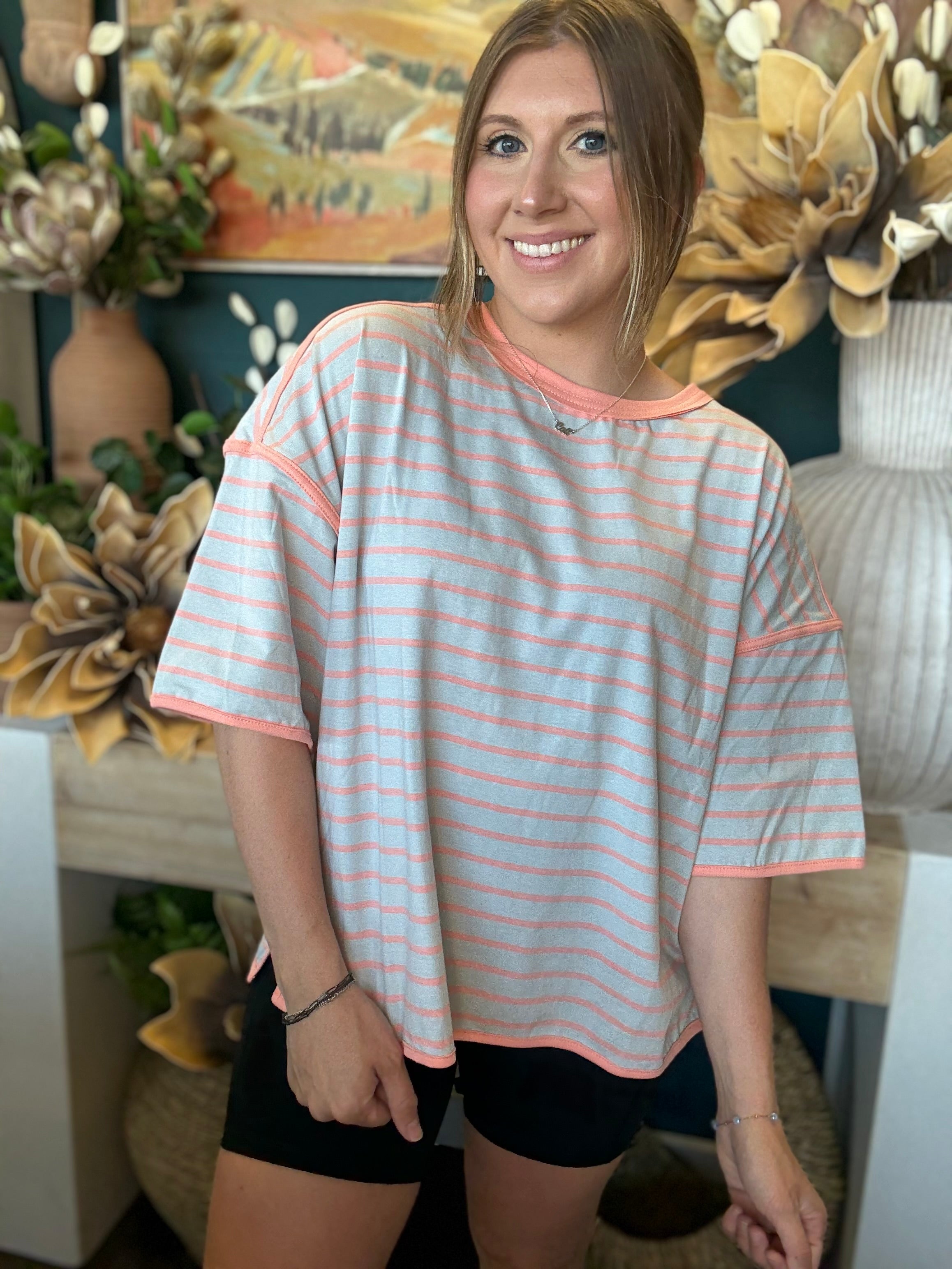 women's blue and apricot striped oversized knit top with relaxed fit and exposed seam details