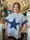 women's oversized gray top with distressed denim star applique and rolled denim sleeves