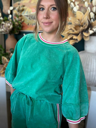 women's green matching short set with balloon sleeves and pink white striped trim