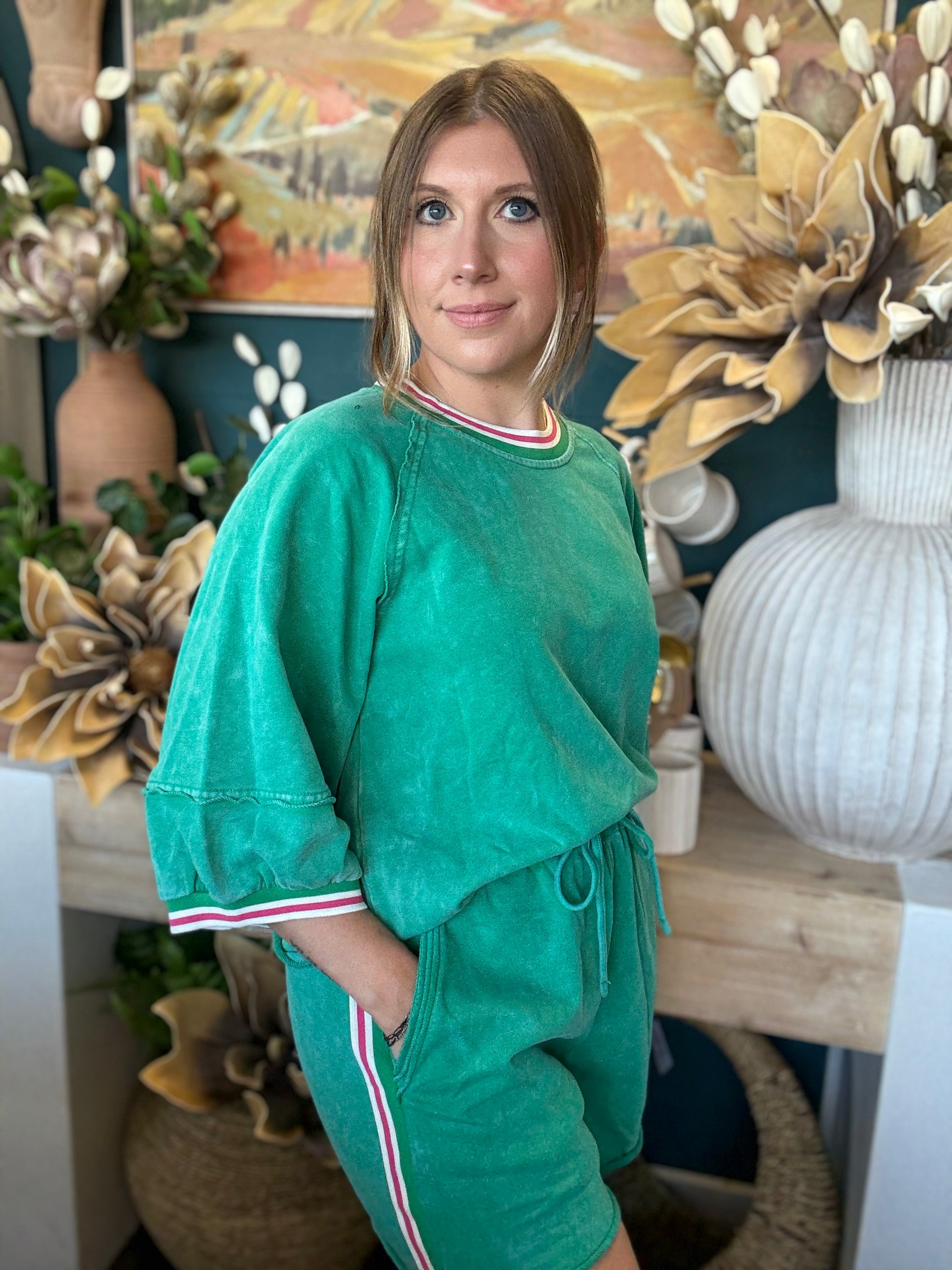 women's green matching short set with balloon sleeves and pink white striped trim