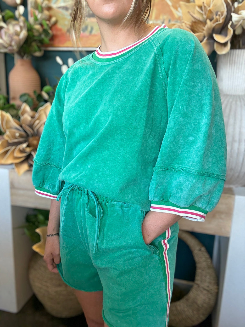 women's green matching short set with balloon sleeves and pink white striped trim
