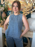 women's sleeveless blue denim top with vertical seam detailing and relaxed fit