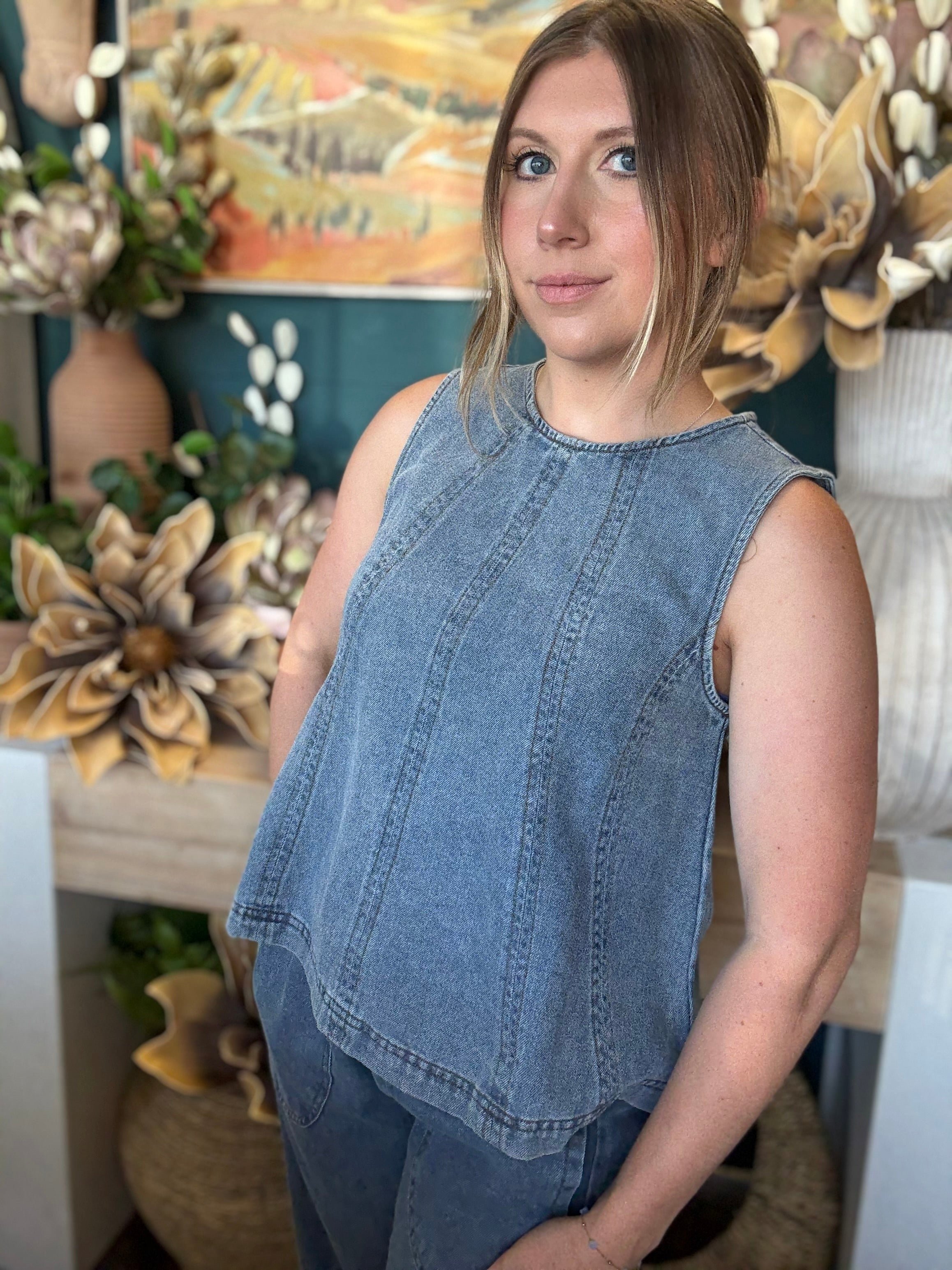 women's sleeveless blue denim top with vertical seam detailing and relaxed fit