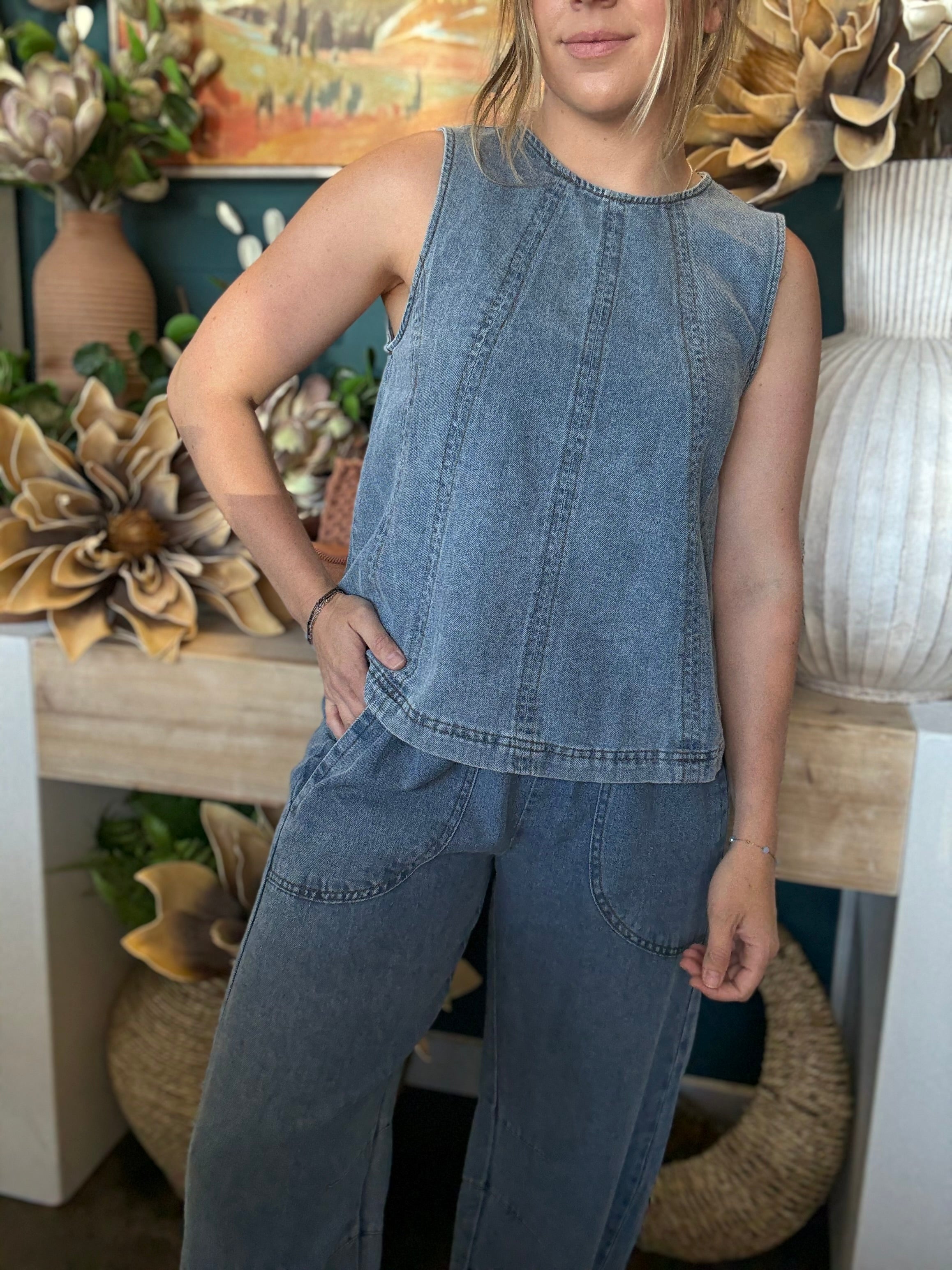 women's sleeveless blue denim top with vertical seam detailing and relaxed fit