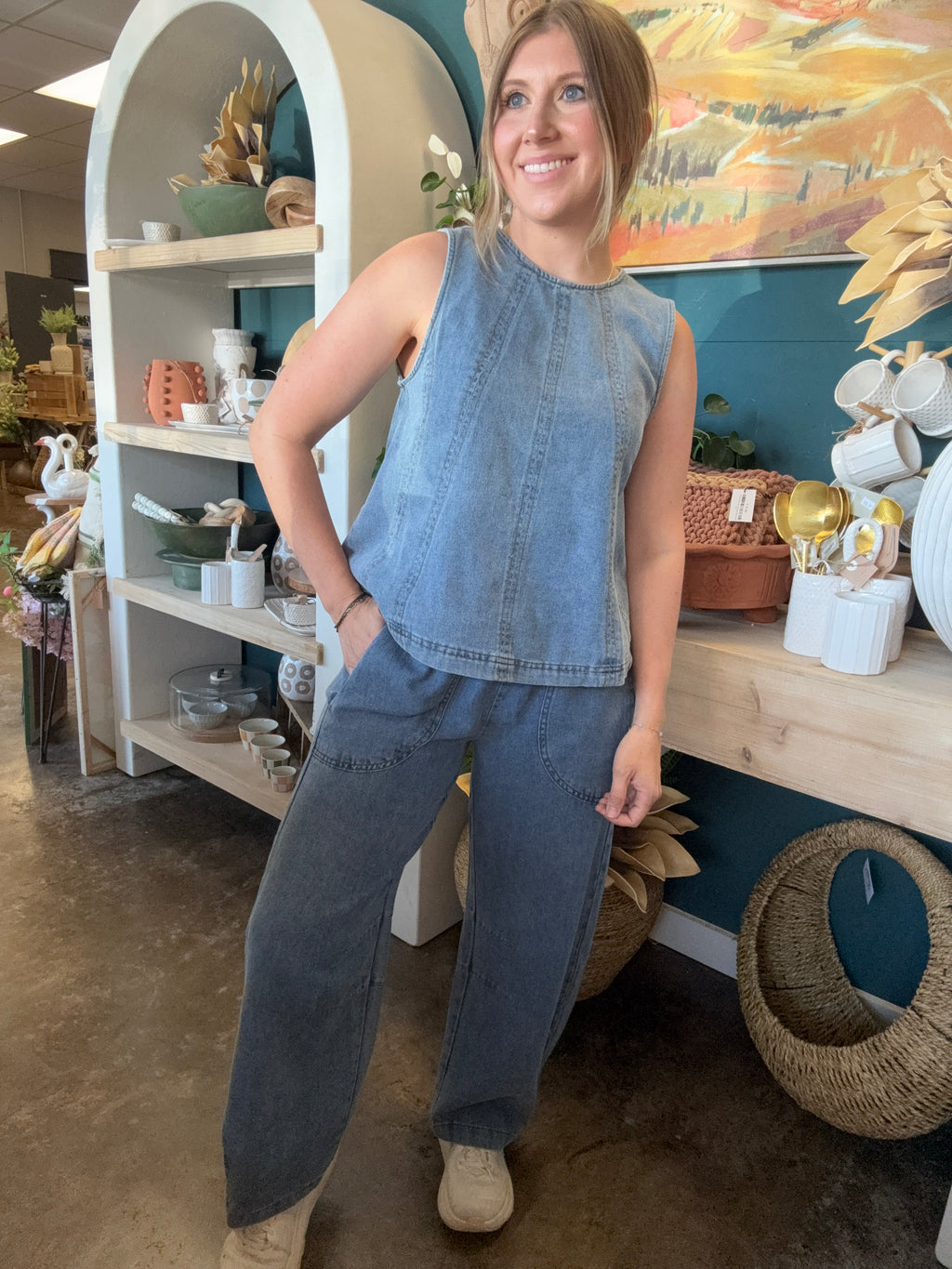 women's sleeveless blue denim top with vertical seam detailing and relaxed fit