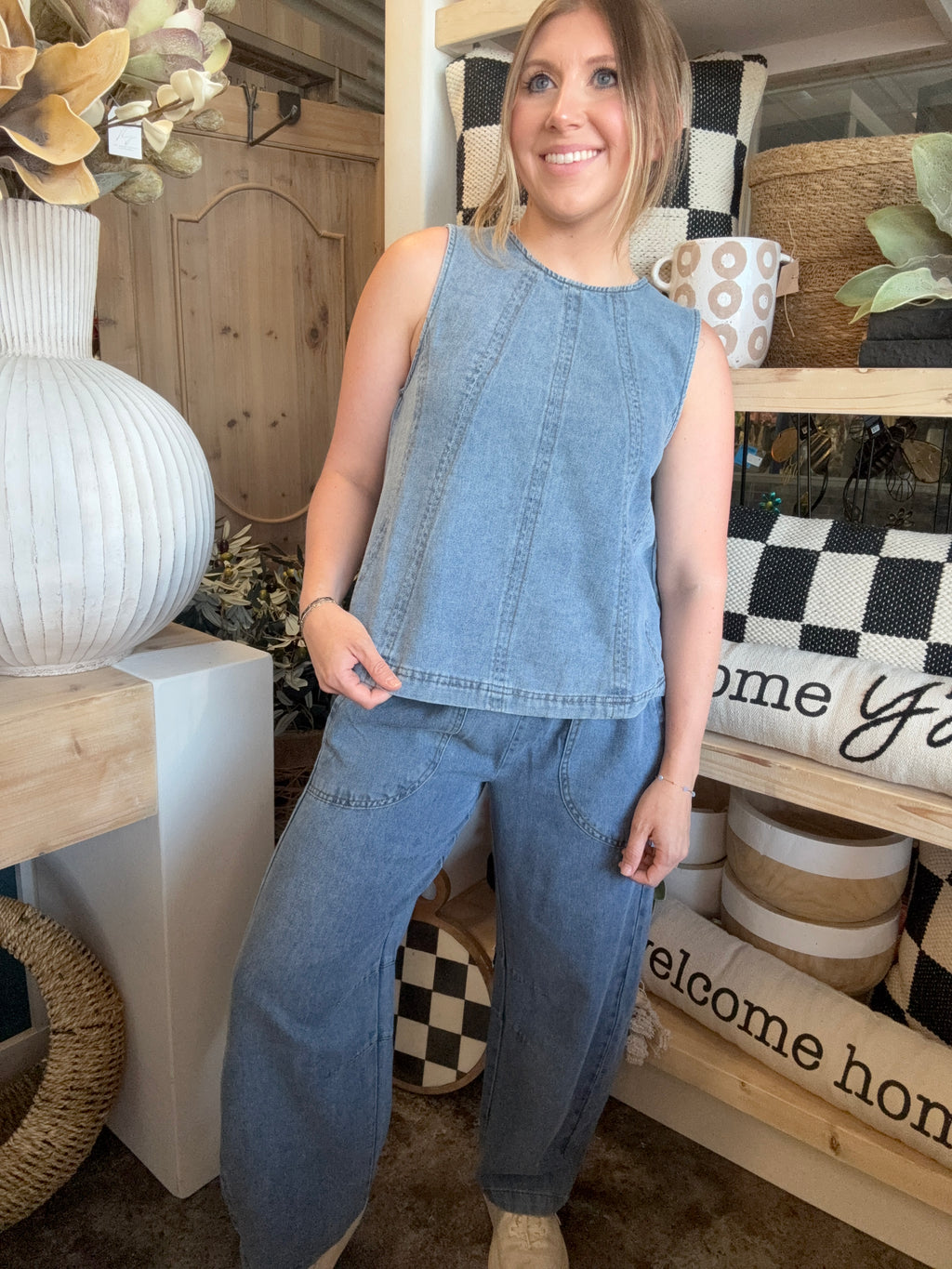 women's sleeveless blue denim top with vertical seam detailing and relaxed fit