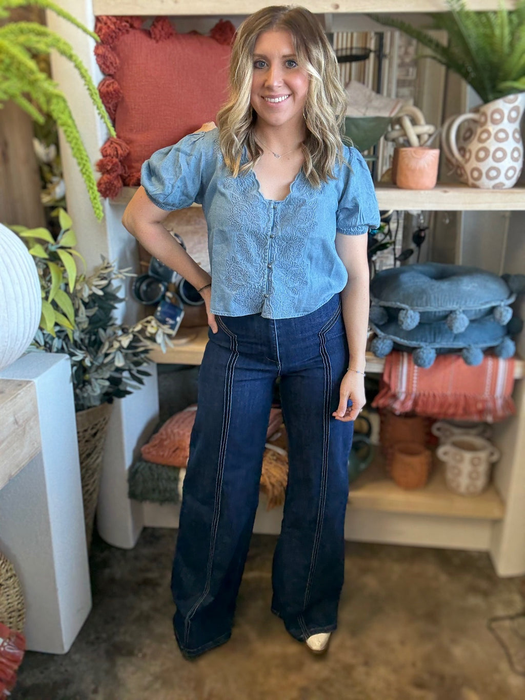 woman wearing embroidered chambray boutique top with puff sleeves and button front

Tags
