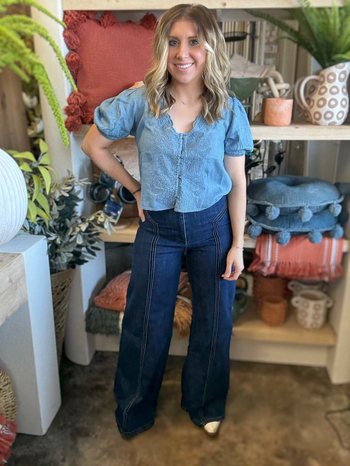 woman wearing embroidered chambray boutique top with puff sleeves and button front

Tags