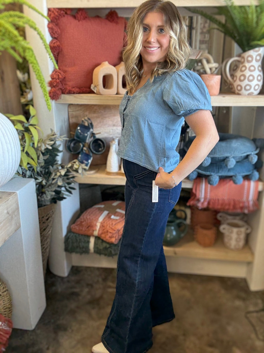 woman wearing embroidered chambray boutique top with puff sleeves and button front

Tags