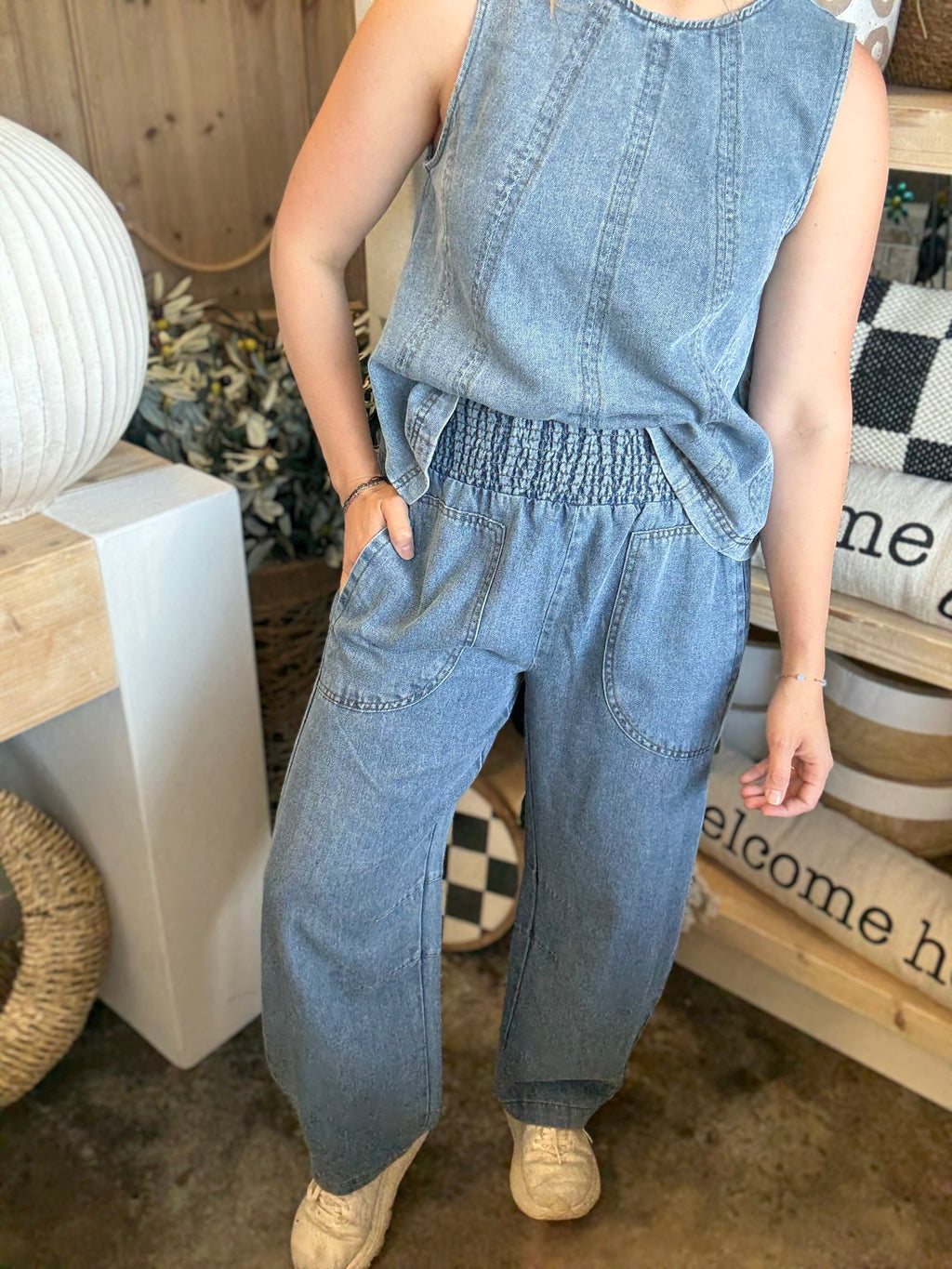 women's sleeveless blue denim top with vertical seam detailing and relaxed fit